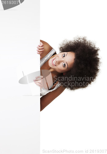 Image of Woman holding a white billboard