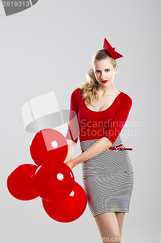 Image of Woman with red ballons