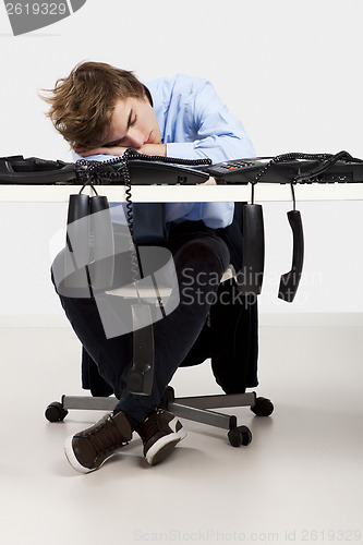 Image of Tired man in the office