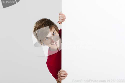 Image of Man holding a cardboard