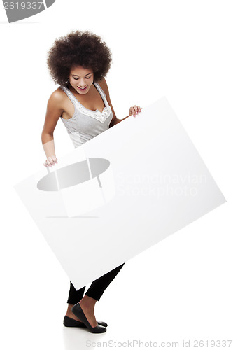 Image of Woman holding a white billboard