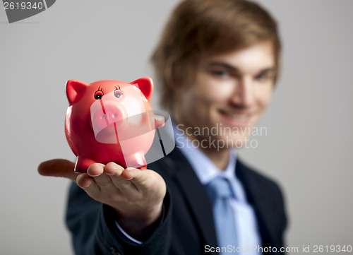 Image of Holding a piggy bank