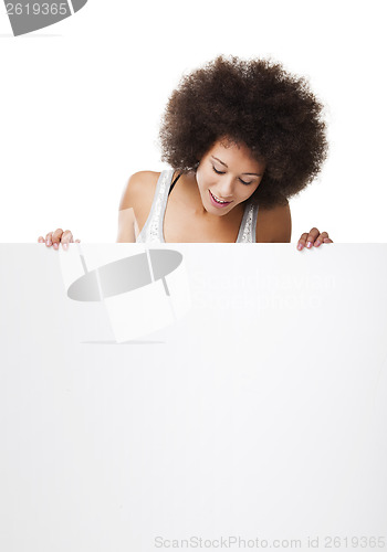 Image of Woman holding a white billboard