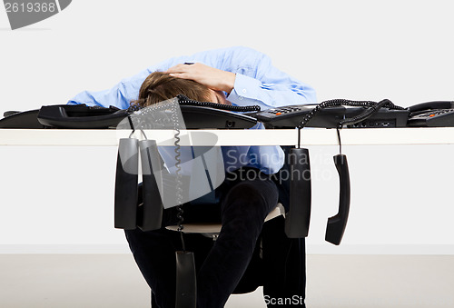 Image of Tired man in the office