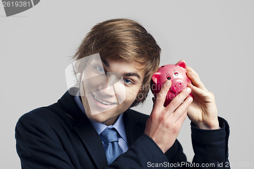 Image of Shaking a piggy bank