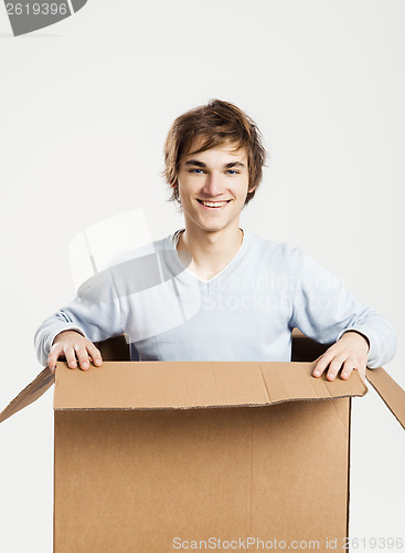 Image of Man inside a card box