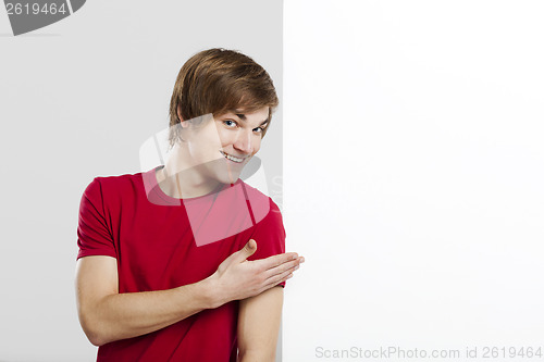 Image of Man holding a cardboard