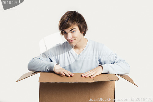 Image of Man inside a card box