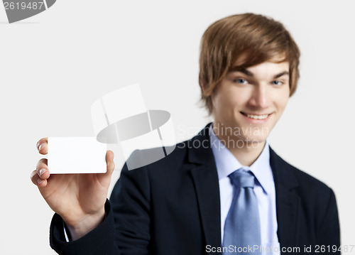 Image of Businessman holding a business card