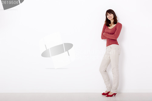 Image of Woman against a white wall