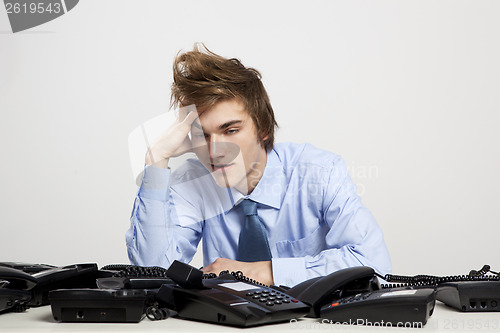 Image of Tired man in the office