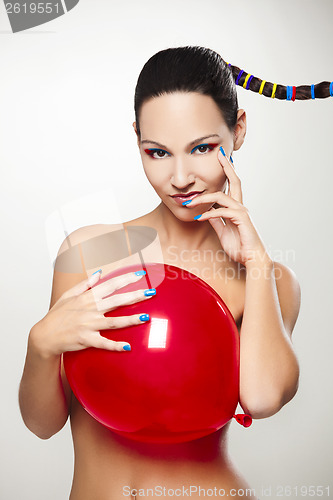 Image of Fashion woman with a red balloon