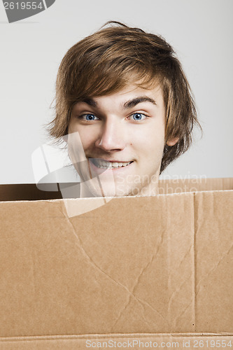 Image of Man inside a card box