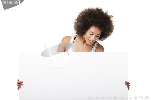 Image of Woman holding a white billboard