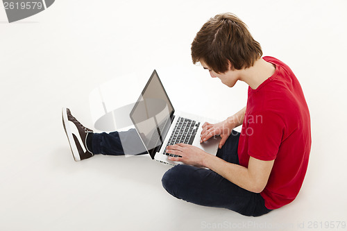 Image of Man working with a laptop