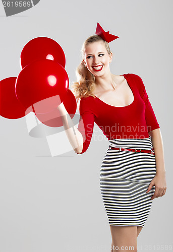 Image of Woman with red ballons