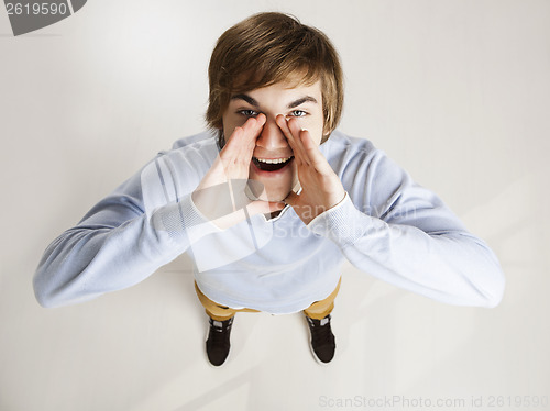 Image of Young man shouting