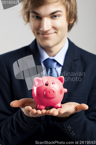 Image of Holding a piggy bank