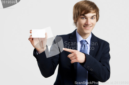 Image of Businessman holding a business card