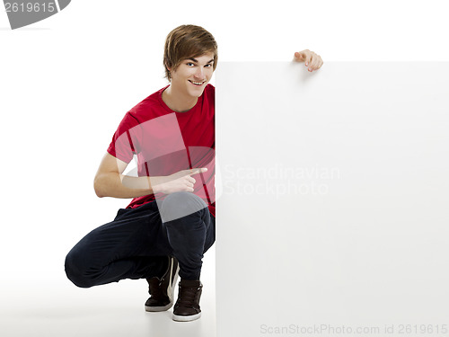 Image of Man holding a cardboard