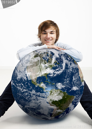 Image of Young man over the earth