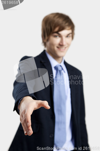 Image of Businessman giving a handshake
