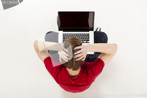 Image of Man working with a laptop