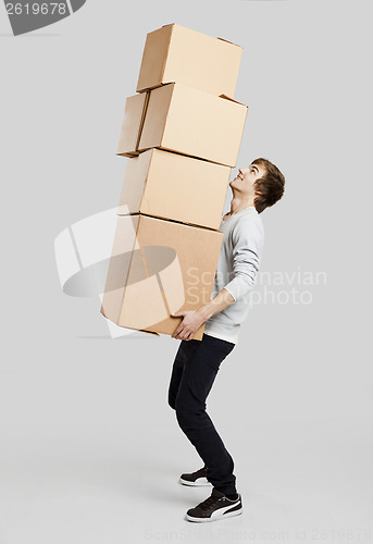 Image of Man holding card boxes