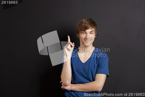 Image of Young man over a chalk board