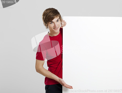Image of Man holding a cardboard