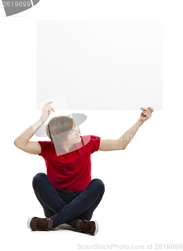 Image of Man holding a cardboard