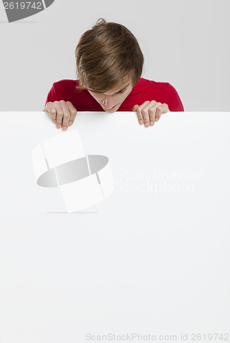 Image of Man holding a cardboard