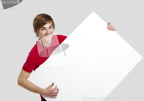 Image of Man holding a cardboard