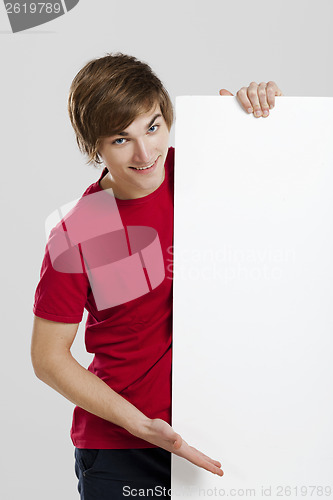 Image of Man holding a cardboard