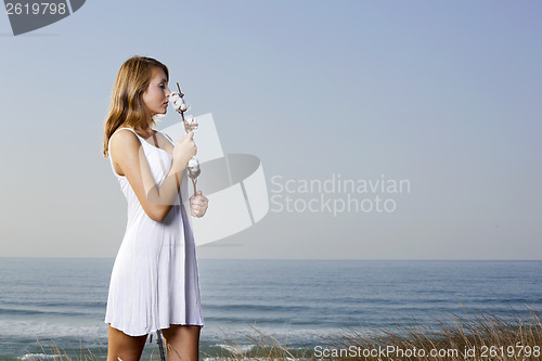 Image of Smelling a cotton plant