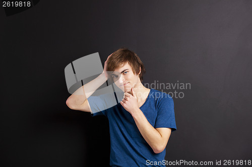 Image of Young man thinking