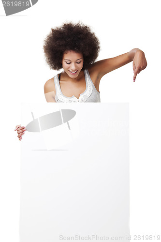 Image of Woman holding a white billboard