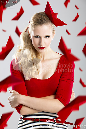 Image of Woman with red paper boats