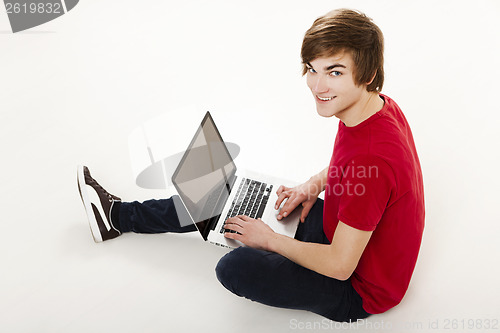Image of Man working with a laptop