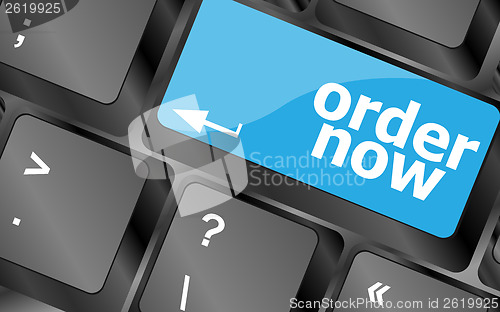 Image of Order now computer key in blue showing online purchases and shopping