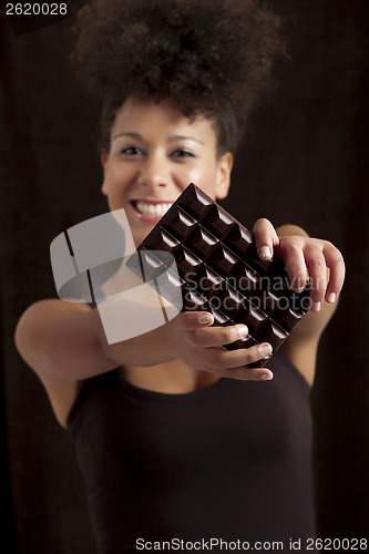 Image of Woman with a chocolate bar