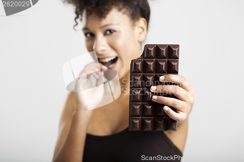 Image of Woman eating chcolate