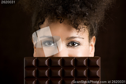 Image of Woman with a chocolate bar