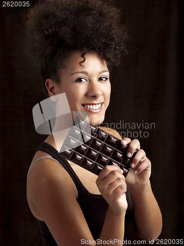 Image of Woman with a chocolate bar