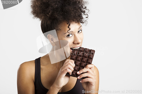 Image of Woman eating chcolate