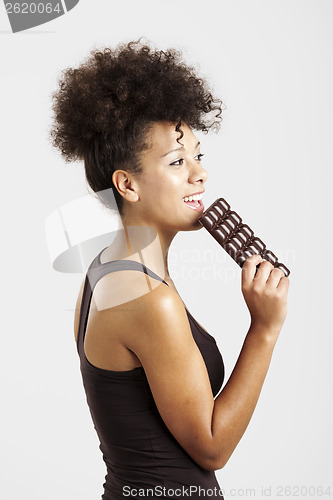 Image of Woman eating chcolate