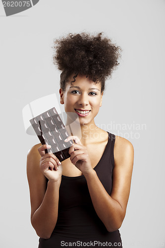 Image of Woman with a chocolate bar