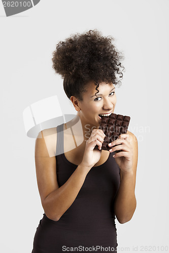 Image of Woman eating chcolate