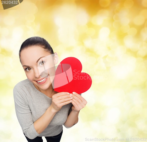 Image of smiling asian woman with red heart