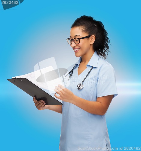 Image of smiling female african american doctor or nurse